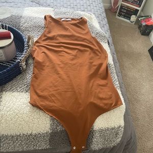 Burnt orange body suit